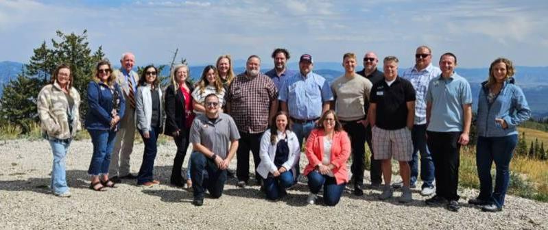 Central Utah Leaders group on the mountain top looking over the valley below